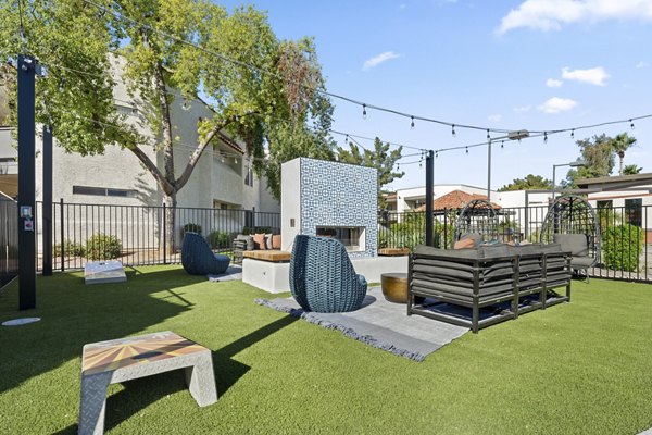 Cozy outdoor fire pit area at 1000 Genoa Lakes Apartments, perfect for social gatherings and relaxation