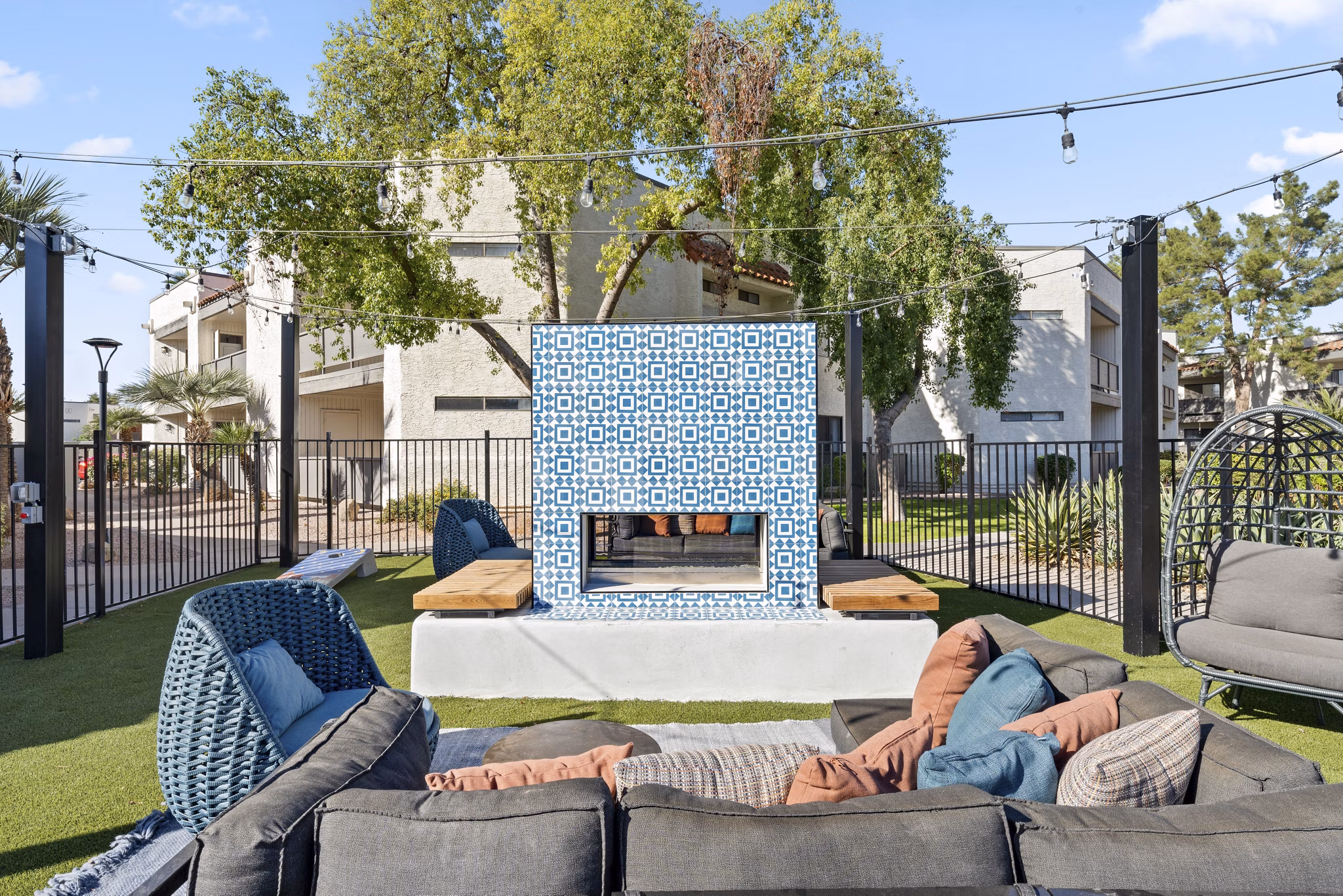 Fire pit surrounded by comfortable seating at 1000 Genoa Lakes Apartments, providing a cozy outdoor experience for residents