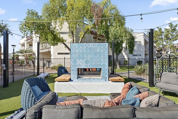 Fire pit surrounded by comfortable seating at 1000 Genoa Lakes Apartments, providing a cozy outdoor experience for residents