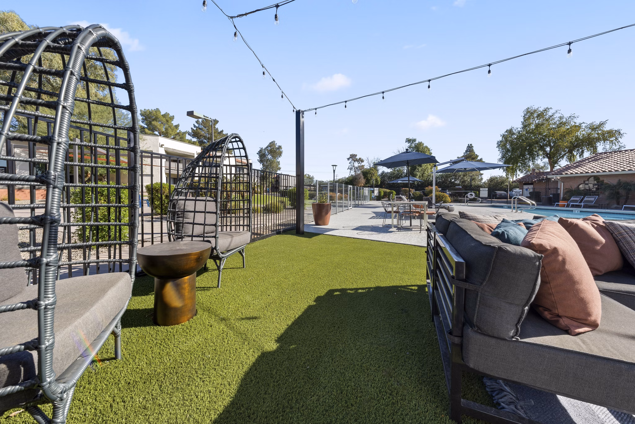 Courtyard featuring serene garden and seating area at 1000 Genoa Lakes Apartments, a Greystar luxury property