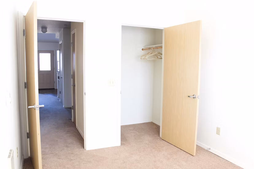 Cozy bedroom with modern furnishings at Timberhill Meadows Apartments, offering luxury living in a peaceful setting