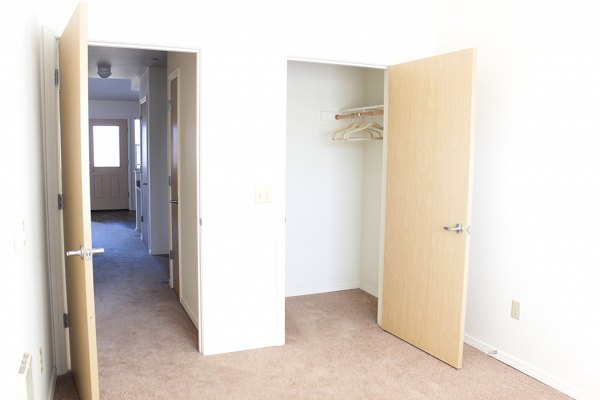 Cozy bedroom with modern furnishings at Timberhill Meadows Apartments, offering luxury living in a peaceful setting