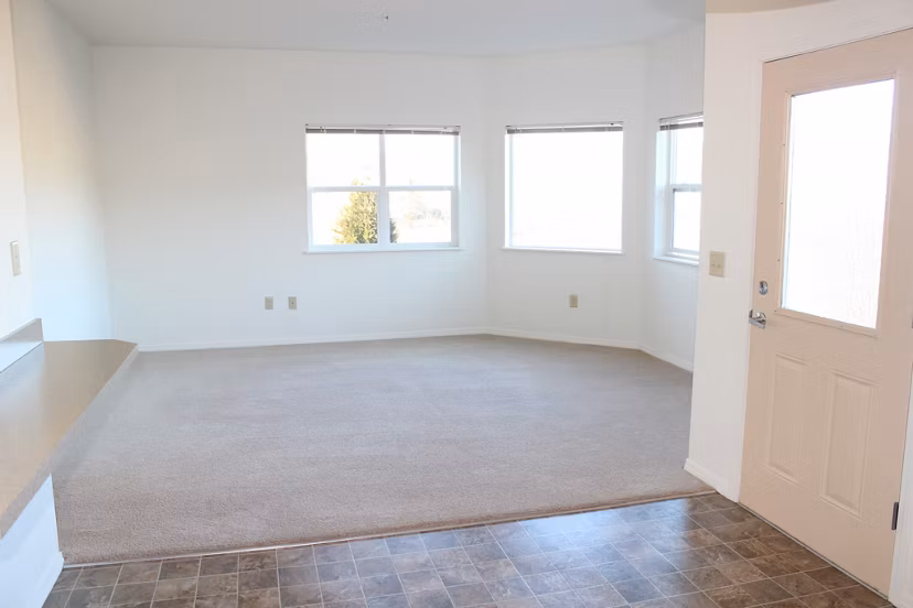 Spacious living room with contemporary decor at Timberhill Meadows Apartments, offering luxury living experiences