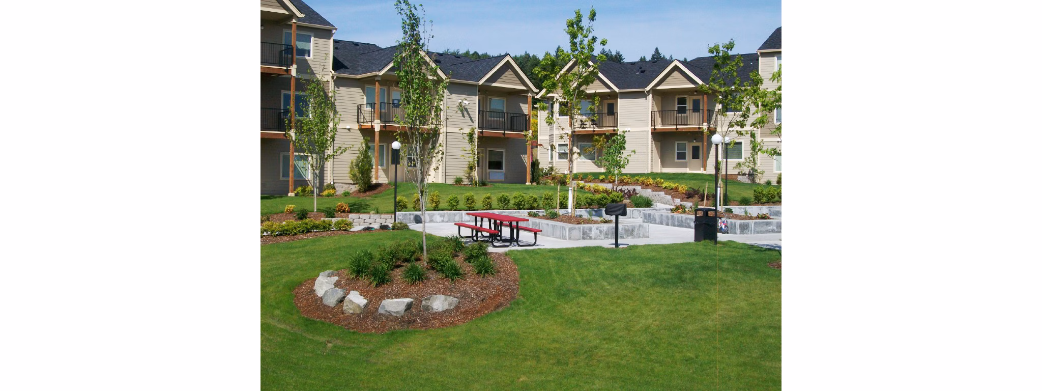 Charming patio with outdoor seating at Timberhill Meadows Apartments, perfect for relaxation amidst nature