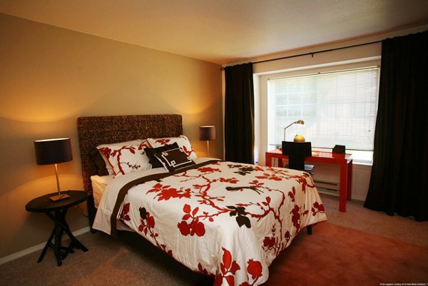 Cozy bedroom with modern furnishings at Jackson School Village Apartments