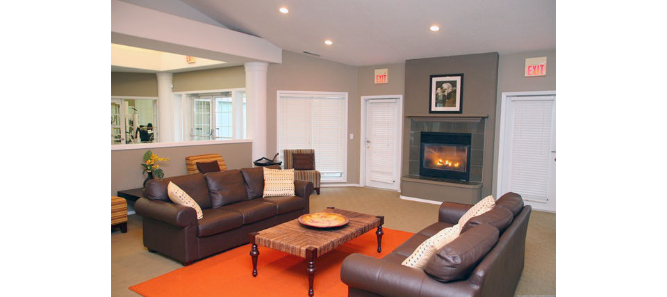 Community clubhouse at Jackson School Village Apartments featuring modern amenities and seating areas