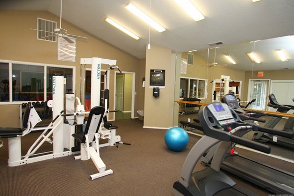 Modern fitness center with state-of-the-art equipment at Jackson School Village Apartments