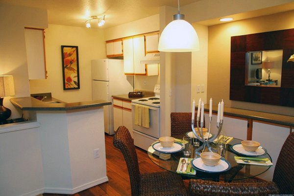 Modern kitchen with stainless steel appliances at Jackson School Village Apartments