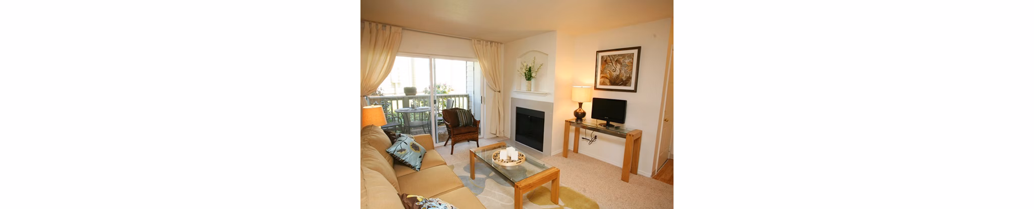 Open-concept living room with modern decor at Jackson School Village Apartments, featuring luxury finishes and abundant natural light