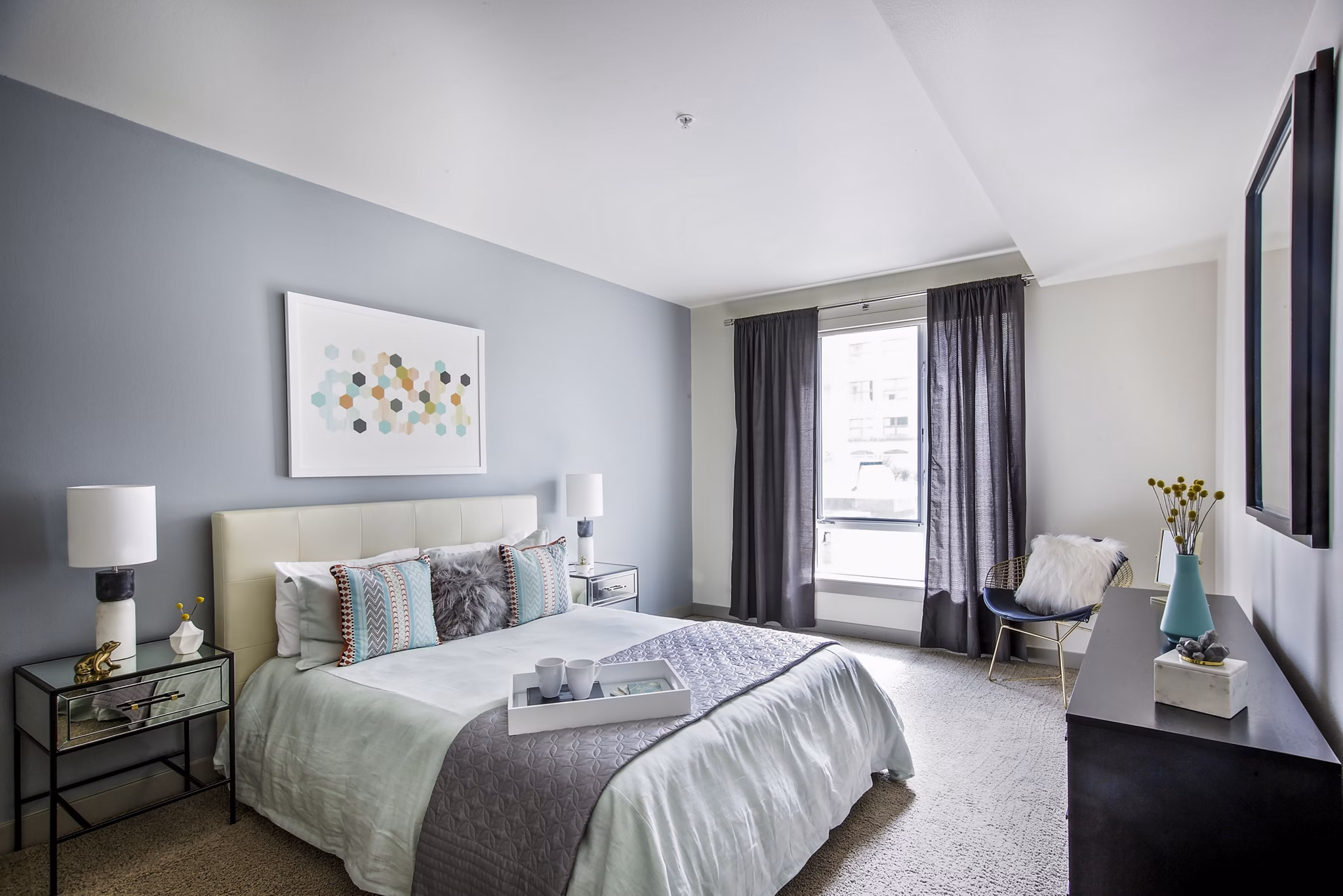 Enso Apartments: Cozy bedroom with modern decor and natural light