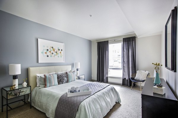 Enso Apartments: Cozy bedroom with modern decor and natural light