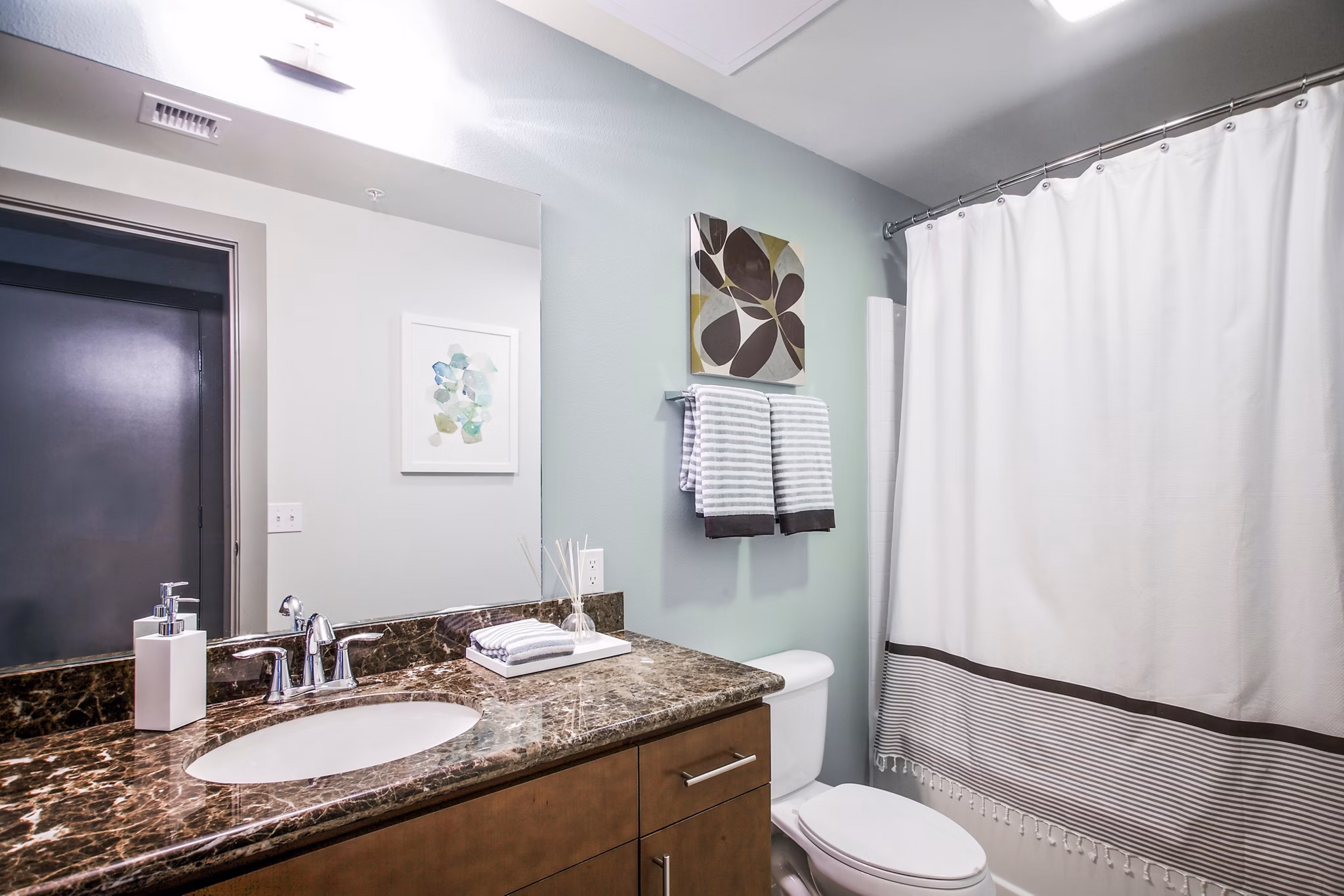 Modern bathroom with elegant fixtures at Enso Apartments, a Greystar luxury apartment community