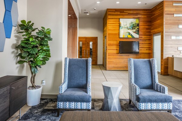 Modern clubhouse lobby with elegant seating and contemporary decor at Enso Apartments