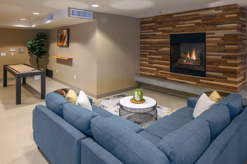 Clubhouse lobby with elegant seating areas and modern decor at Enso Apartments