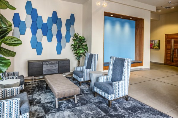 Clubhouse lobby with elegant seating areas and modern decor at Enso Apartments