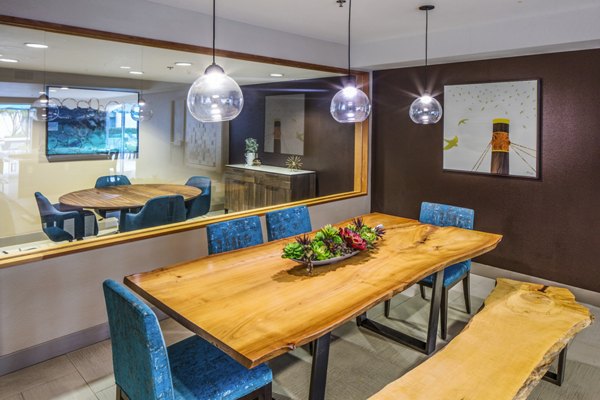 Modern clubhouse with communal seating and entertainment options at Enso Apartments, part of Greystar's luxury living portfolio