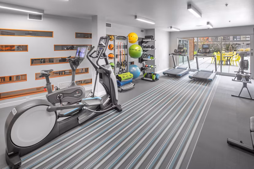 State-of-the-art fitness center equipped with modern machines at Enso Apartments, ideal for maintaining a healthy lifestyle