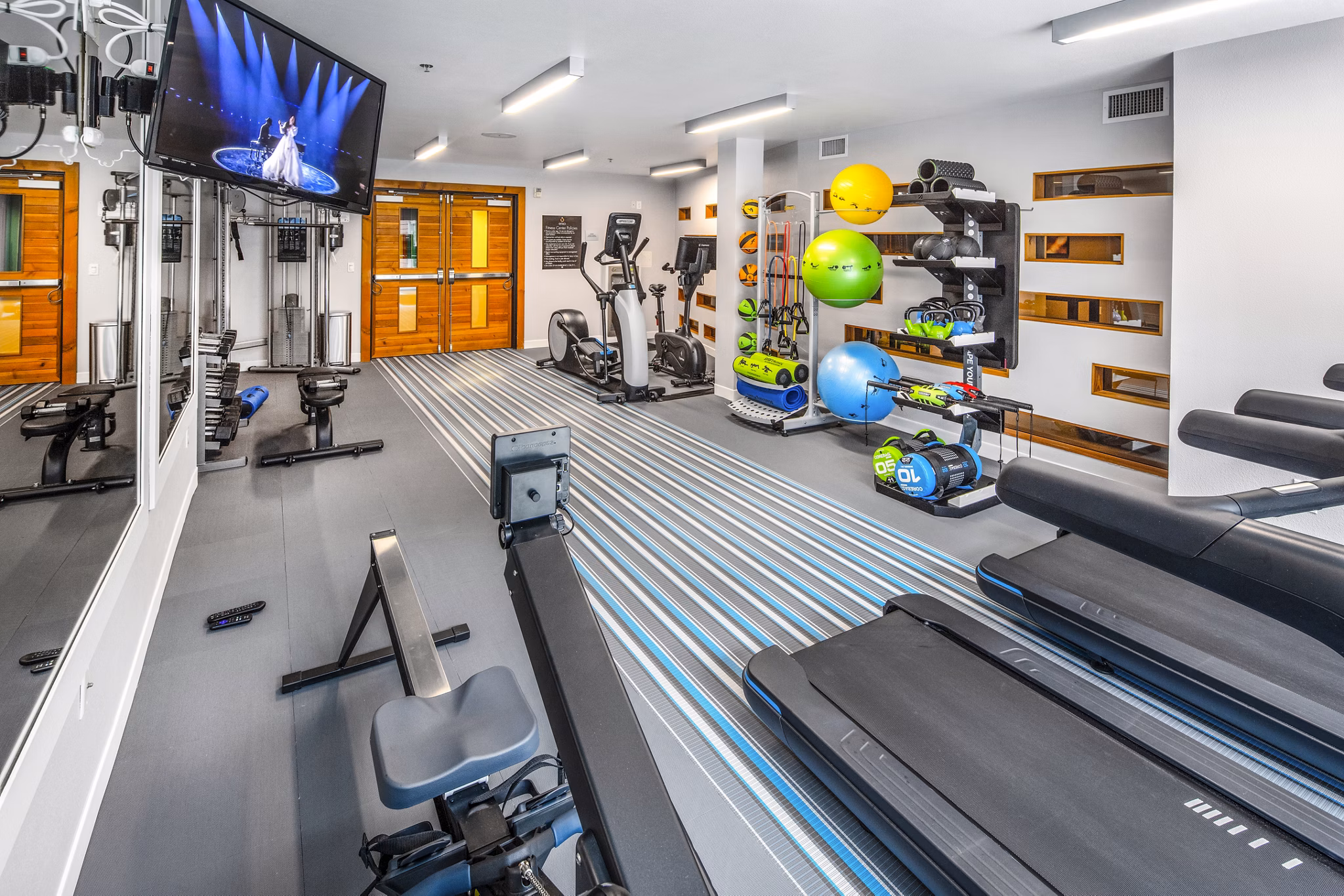 State-of-the-art fitness center equipped with modern machines at Enso Apartments, ideal for maintaining a healthy lifestyle