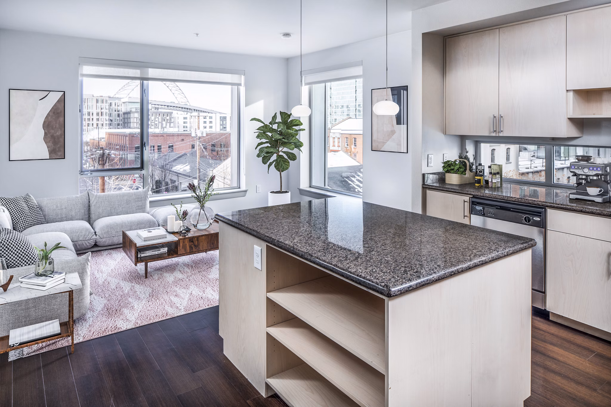 Modern kitchen with sleek appliances and marble countertops at Enso Apartments