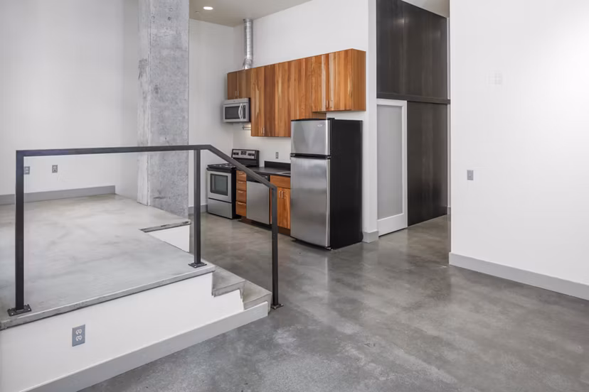 Modern kitchen with stainless steel appliances at Enso Apartments, a luxury Greystar community