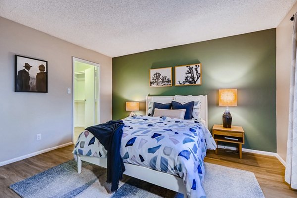 Cozy bedroom with soft lighting and modern furnishings at Rockledge Fairways Apartments