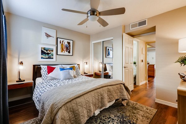Stylish bedroom with modern decor at Scottsdale Gateway Apartments, offering luxury living in a prime Scottsdale location