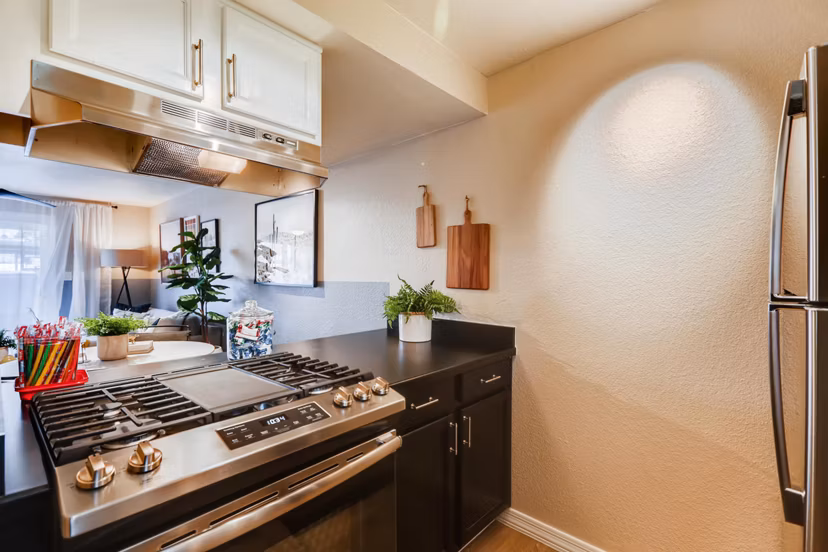 Modern kitchen with stainless steel appliances in Scottsdale Gateway Apartments, ideal for comfortable living in luxurious settings