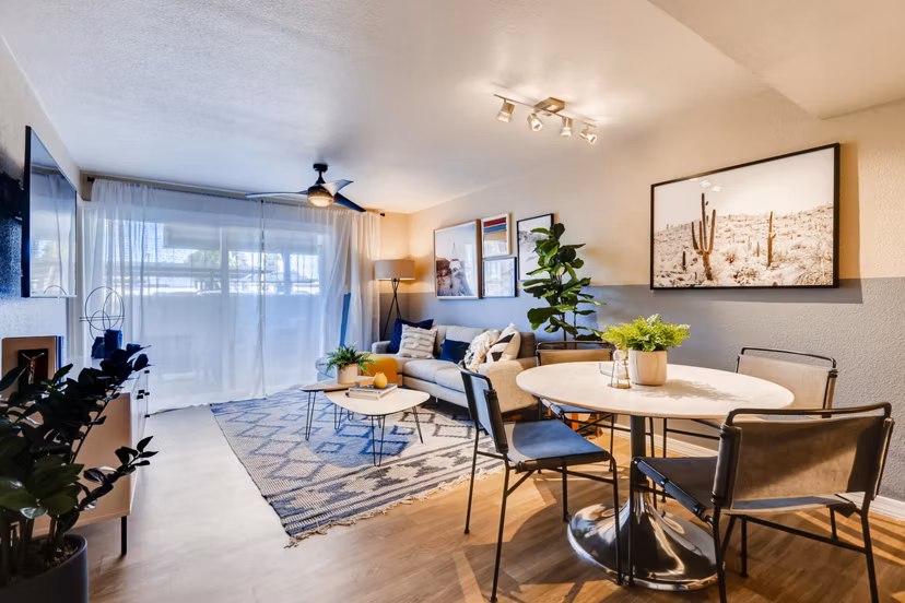 Living room with modern decor and large windows at Scottsdale Gateway Apartments in Scottsdale, offering comfort and style for residents