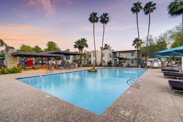 Resort-style outdoor pool with lounge seating at Scottsdale Gateway Apartments