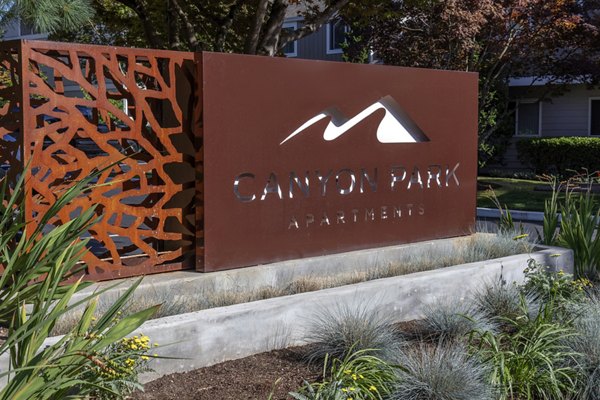 Canyon Park Apartments: Contemporary entrance signage at luxury apartments in serene neighborhood setting