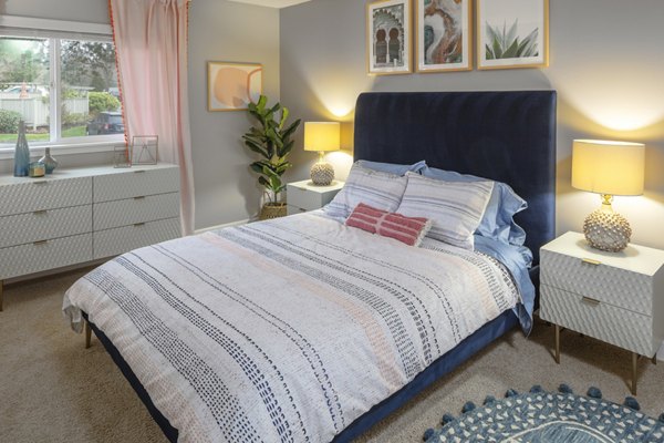 Spacious bedroom featuring modern decor and large windows at Canyon Park Apartments