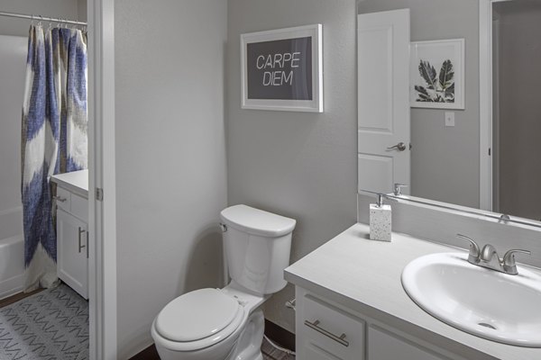 Bathroom with modern fixtures at Canyon Park Apartments featuring sleek design and ample lighting, a hallmark of luxury living