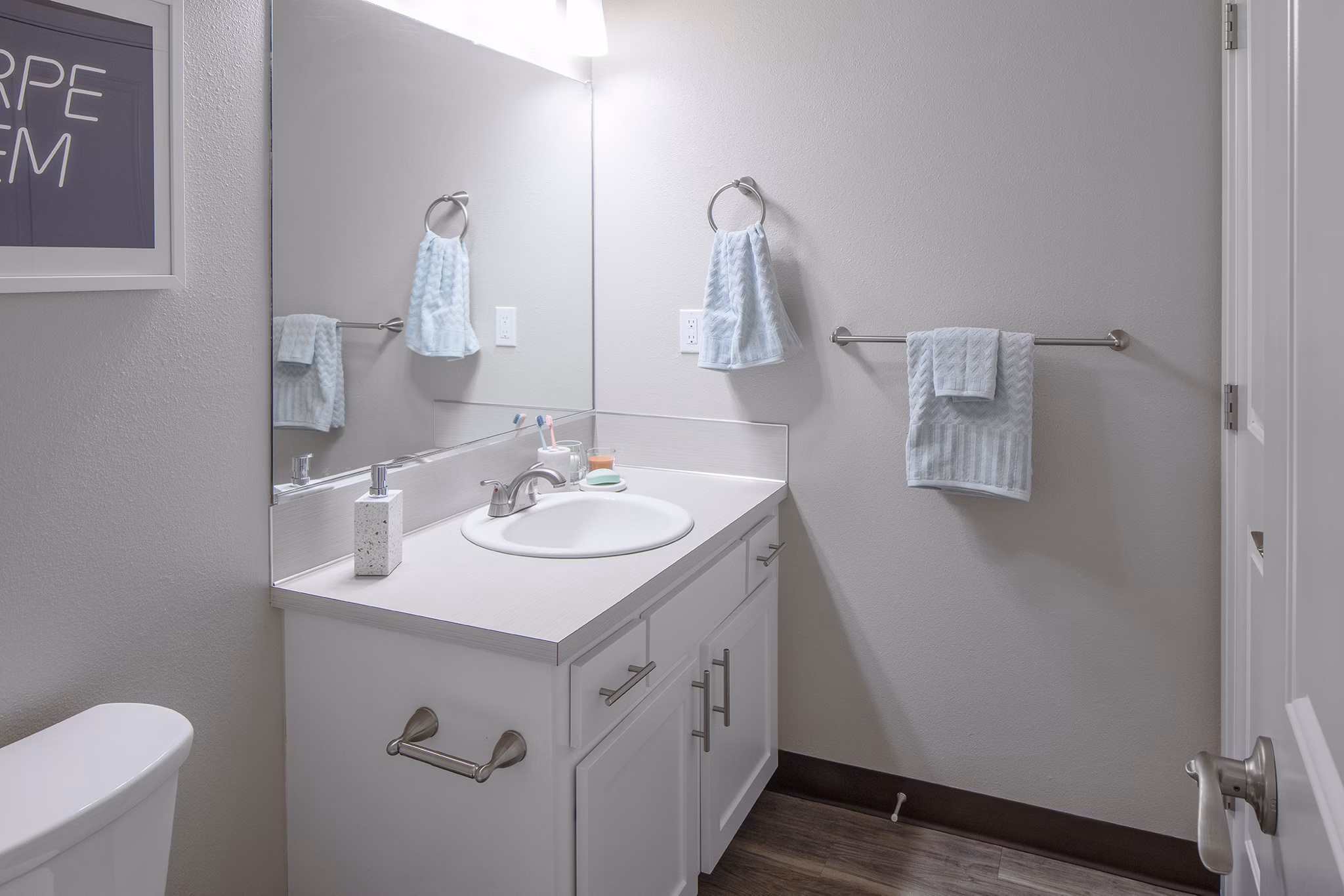 Modern bathroom featuring marble countertops and sleek fixtures at Canyon Park Apartments in Greystar luxury living community