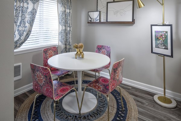 Dining area featuring modern furnishings and elegant lighting at Canyon Park Apartments, a luxury Greystar property