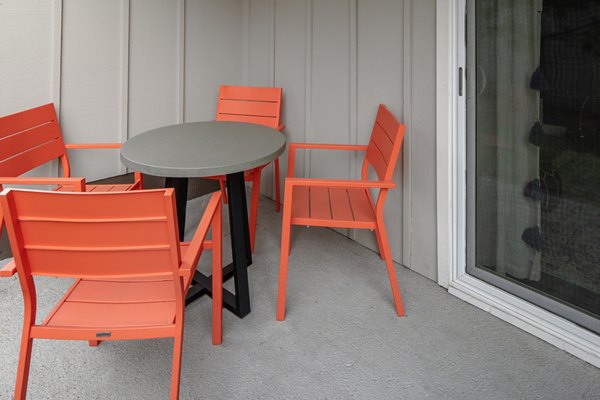 Tranquil outdoor patio with modern seating at Canyon Park Apartments, perfect for relaxation and socializing in a luxury setting