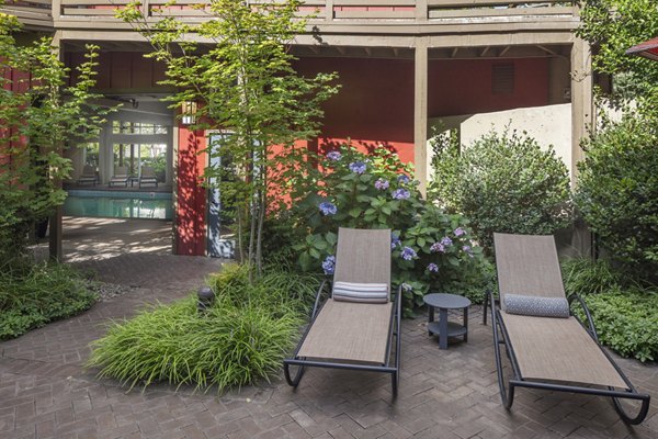 Canyon Park Apartments: Lush courtyard with walking paths and seating areas, perfect for relaxation and community gatherings