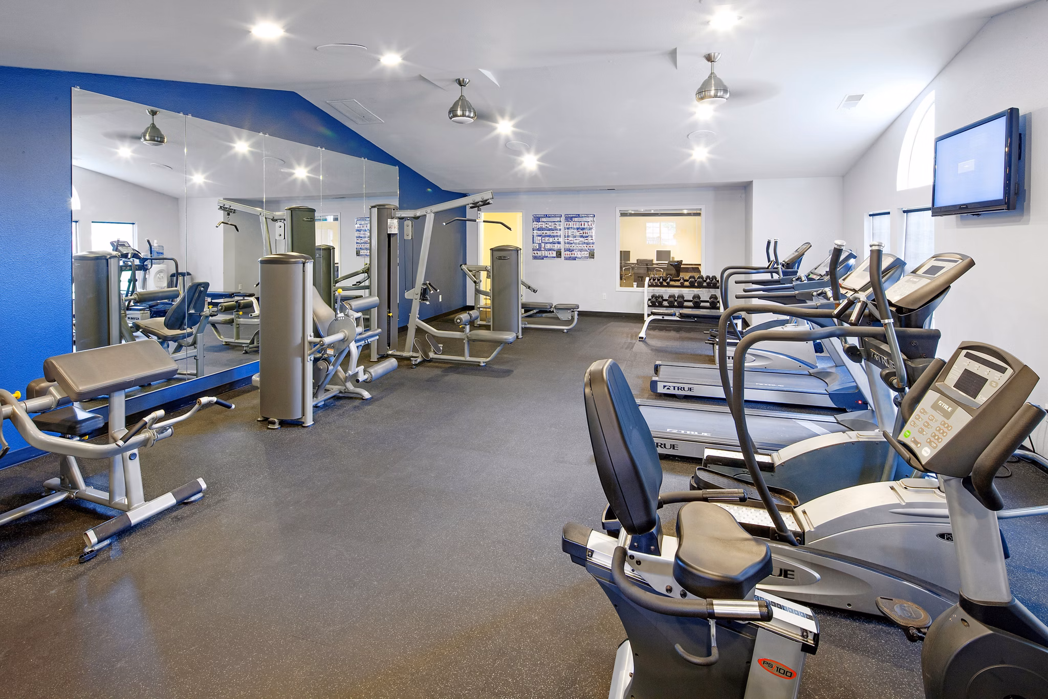 State-of-the-art fitness center with modern equipment at Landmark at Tanasbourne Apartments in Portland