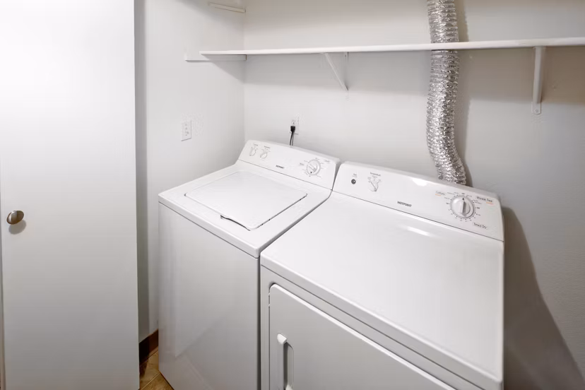 Laundry room equipped with modern washers and dryers at Landmark at Tanasbourne Apartments