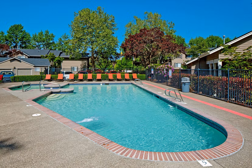 Luxurious pool area with cozy loungers at Landmark at Tanasbourne Apartments, perfect for relaxation and leisure activities