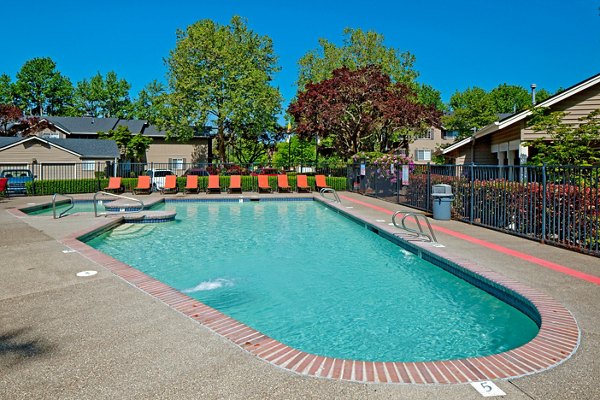Luxurious pool area with cozy loungers at Landmark at Tanasbourne Apartments, perfect for relaxation and leisure activities