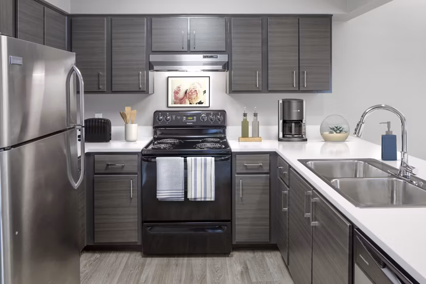 Modern kitchen with sleek countertops and stainless steel appliances at Crescent Park Apartments