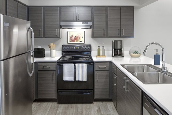 Modern kitchen with sleek countertops and stainless steel appliances at Crescent Park Apartments