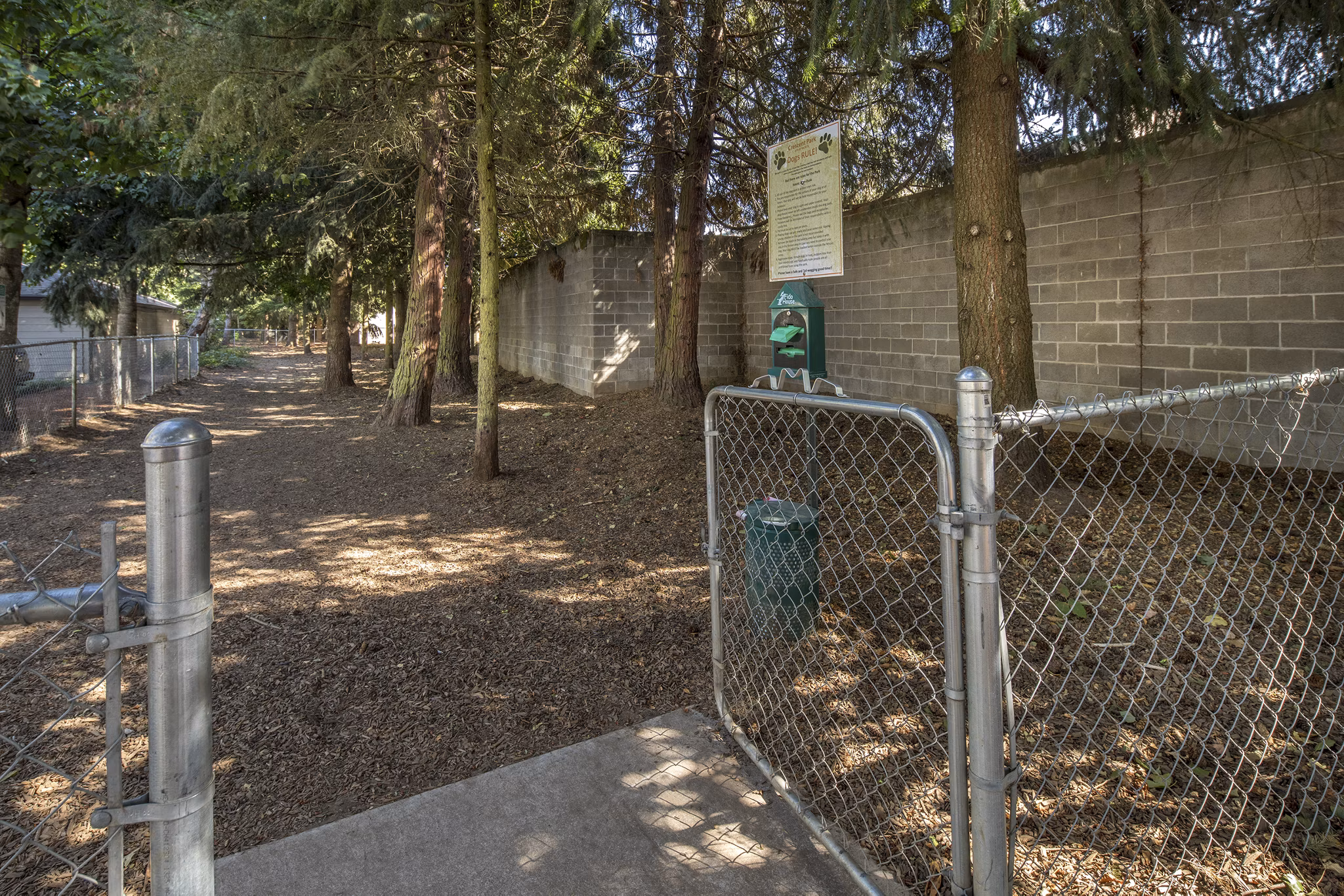 Crescent Park Apartments: Spacious dog park featuring agility course for pet-friendly living