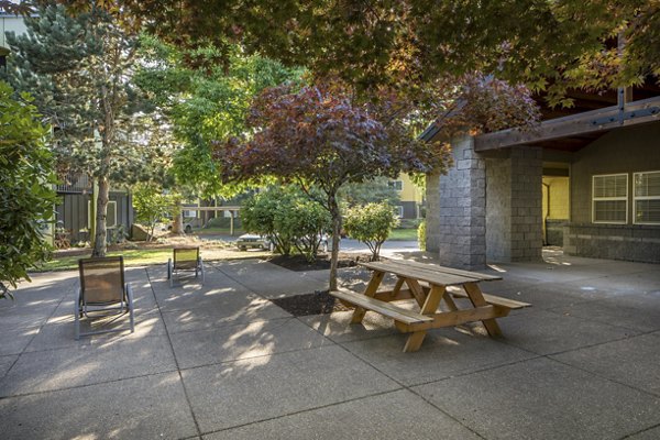Crescent Park Apartments: Tranquil courtyard with lush greenery and seating areas for relaxation