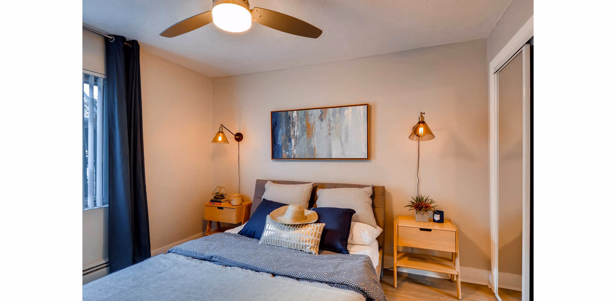 Spacious bedroom with stylish decor at Park Plaza Apartments, a luxury living option by Greystar