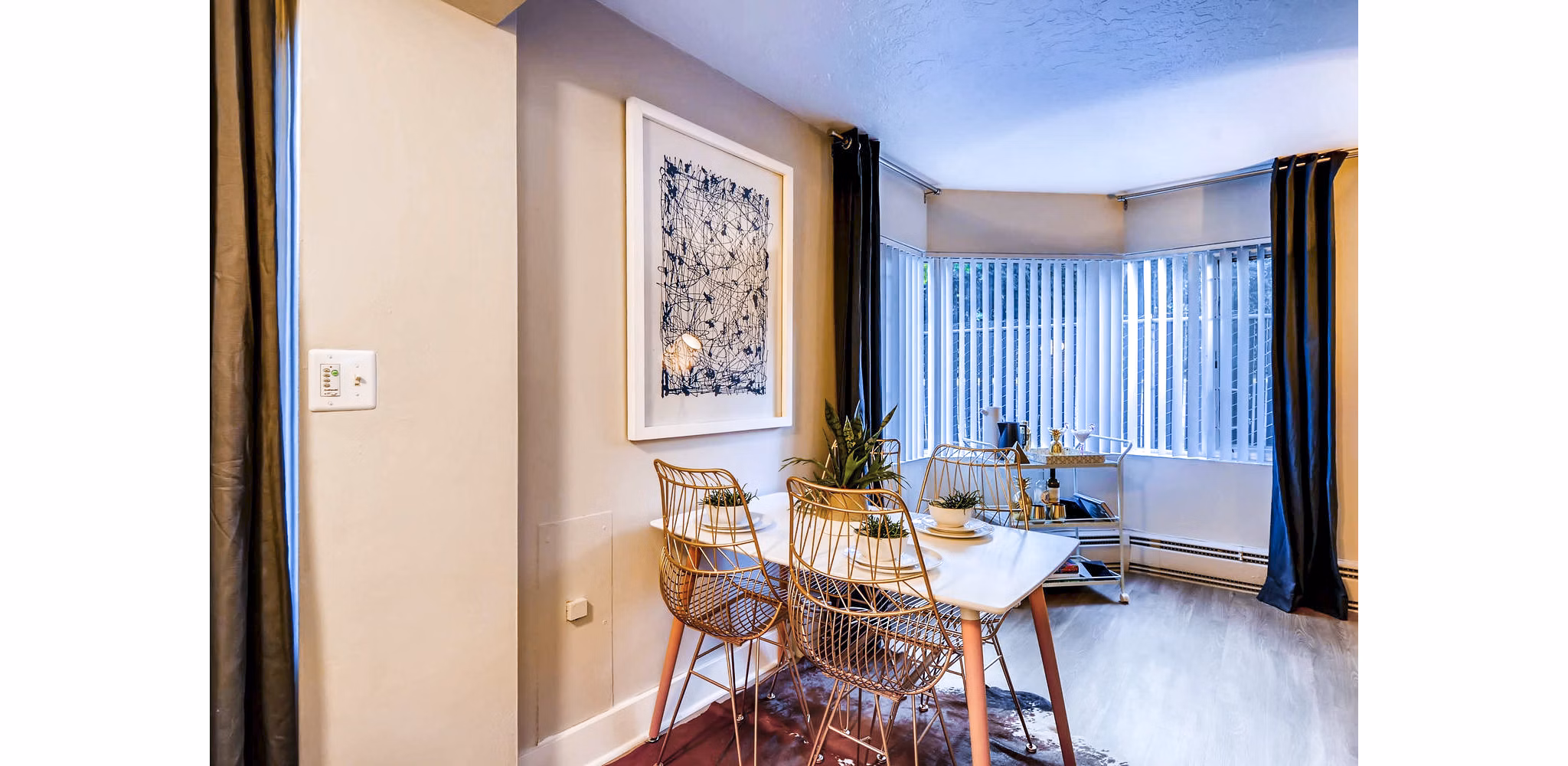 Dining room featuring elegant dining set and ambient lighting at Park Plaza Apartments
