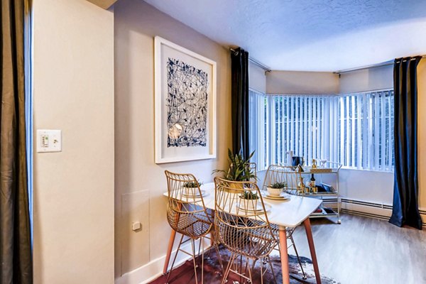 Dining room featuring elegant dining set and ambient lighting at Park Plaza Apartments