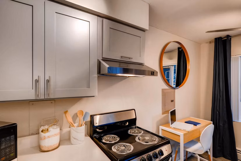 Sleek kitchen with stainless steel appliances and modern cabinetry in Park Plaza Apartments