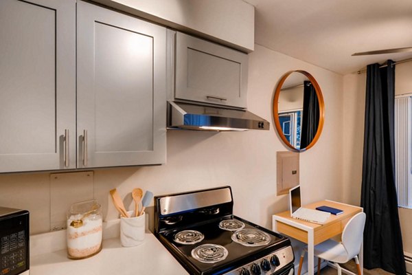Sleek kitchen with stainless steel appliances and modern cabinetry in Park Plaza Apartments