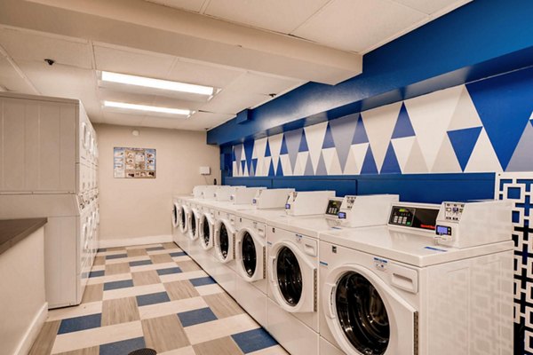 Modern laundry facility at Park Plaza Apartments offering high-end washing machines and dryers for convenient living